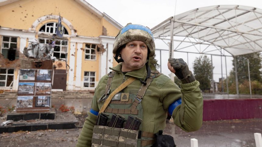 A Ukrainian soldier stands in Sudzha, Russia, on October 8 — months into the country's surprise incursion.