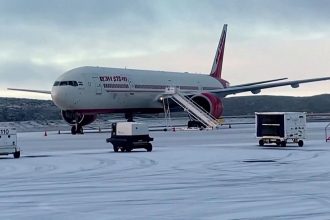 An Air India plane sits on the runway in Iqaluit, Canada, on October 15, after making an emergency landing due to a bomb threat.