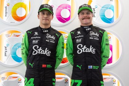 Kick Sauber F1 drivers Zhou Guanyu (L) and Valtteri Bottas pose in front of Zero fuel cans. The company is an official partner of the team.