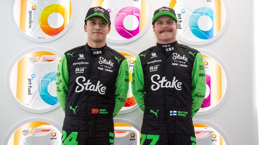 Kick Sauber F1 drivers Zhou Guanyu (L) and Valtteri Bottas pose in front of Zero fuel cans. The company is an official partner of the team.