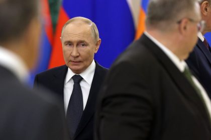 Russian President Vladimir Putin enters the hall of the Grand Kremlin Palace in Moscow during a summit of ex-Soviet states on October 8.