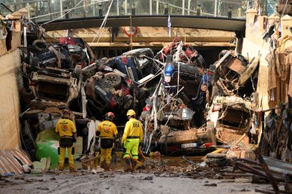 Members of a fire brigade search and rescue unit work on November 1, 2024 as cars and debris block a tunnel after flash flooding in the Benetusser municipality of Valencia, Spain.