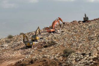 Israeli diggers build a new barrier near the village of Bardala in the occupied West Bank.