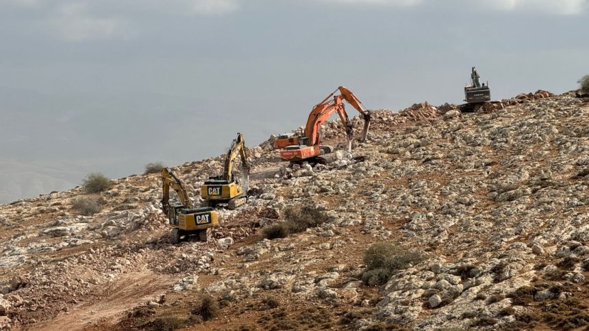 Israeli diggers build a new barrier near the village of Bardala in the occupied West Bank.