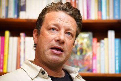 Jamie Oliver, pictured in 2023, at his local independent bookshop, Harts in Saffron Walden, Essex, UK.