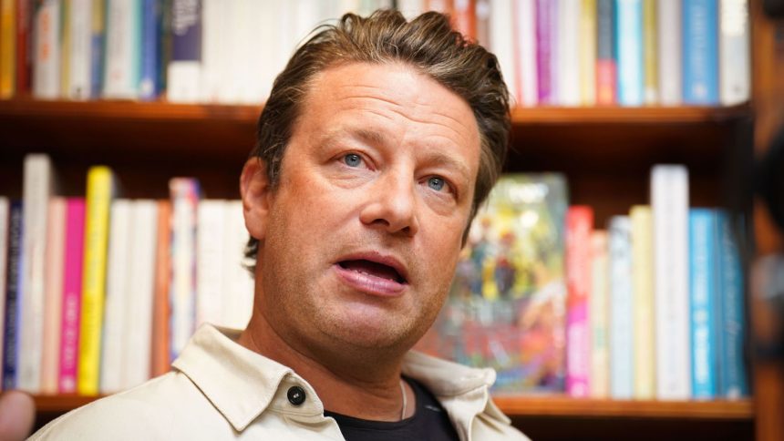 Jamie Oliver, pictured in 2023, at his local independent bookshop, Harts in Saffron Walden, Essex, UK.