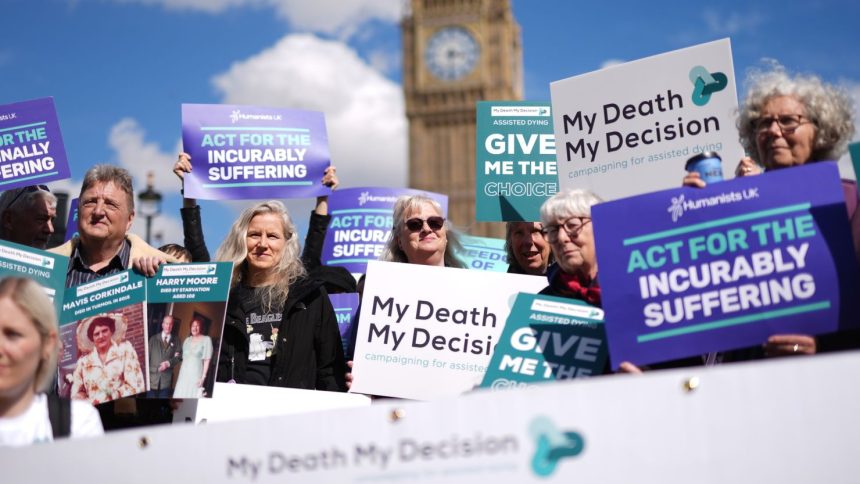 Activists support assisted dying in Westminster in April. Friday's vote is the culmination of a years-long campaignn.