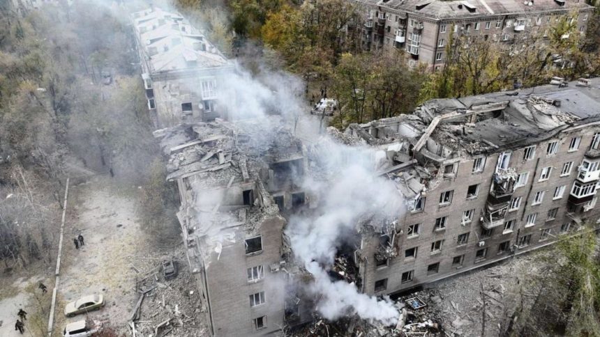 In this image provided by the Ukrainian Emergency Service on Monday, Nov. 11, 2024, a smoke rises out of an apartments building after a Russian attack in Kryvyi Rih, Ukraine. (Ukrainian Emergency Service via AP)