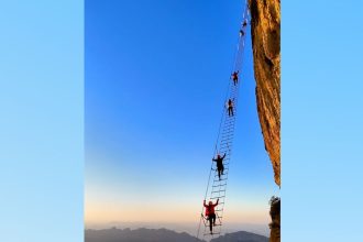 Travelers climbing the "sky ladder."