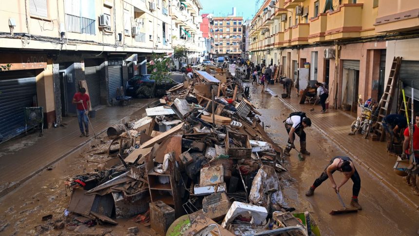 Debris piled up along a street on November 1, 2024, following the devastating effects of flooding on the town of Paiporta, in the region of Valencia, eastern Spain.