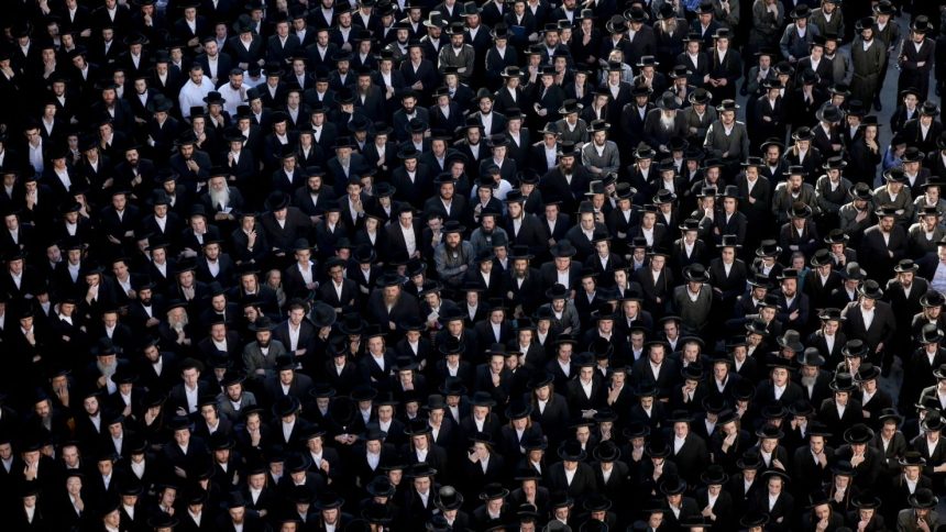 Ultra-Orthodox Jewish men in Jerusalem protest a Supreme Court ruling that they cannot be exempt from military service in June, 2024.