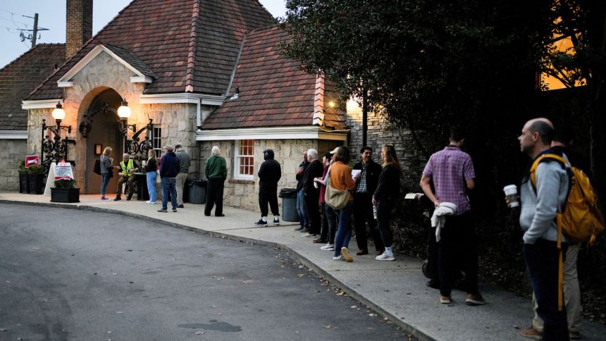 People line up to vote in the 2024 U.S. presidential election on Election Day at Park Tavern in Atlanta, Georgia, on November 5, 2024.