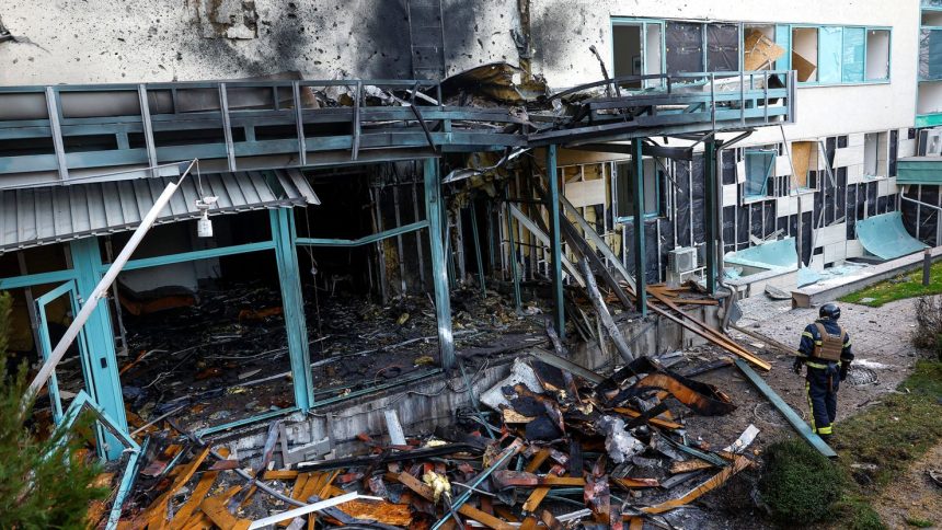 A firefighter responds to damage at a medical center after a Russian drone strike on Kyiv, Ukraine, on Thursday.