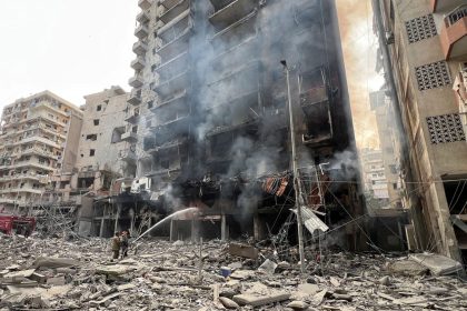 Firefighters work at a damaged site, in the aftermath of Israeli strikes, in Beirut's southern suburbs on November 9, 2024.