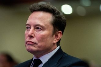 Tesla CEO and X owner Elon Musk listens as US President-elect Donald Trump speaks during a meeting with House Republicans at the Hyatt Regency hotel in Washington, DC, U.S. on November 13, 2024.