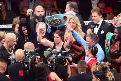 Katie Taylor celebrates her win against Amanda Serrano to retain her undisputed world light-welterweight champion status.