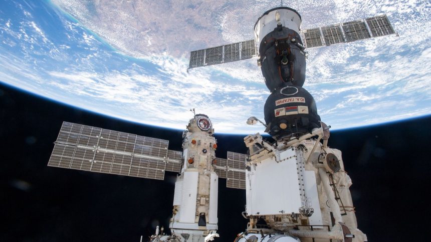 Russia's Nauka module is seen docked to the Zvezda module's Earth-facing port on the International Space Station on July 29, 2021. The Soyuz MS-18 crew ship (center) is docked to the Rassvet module.