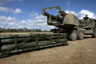 US Army Sgt. Ian Ketterling, gunner for Alpha Battery, 1st Battalion, 3rd Field Artillery Regiment, 17th Field Artillery Brigade, prepares the crane for loading the Army Tactical Missile System (ATACMS) on to the High Mobility Artillery Rocket System (HIMARS) in Queensland, Australia, on July 26, 2023.