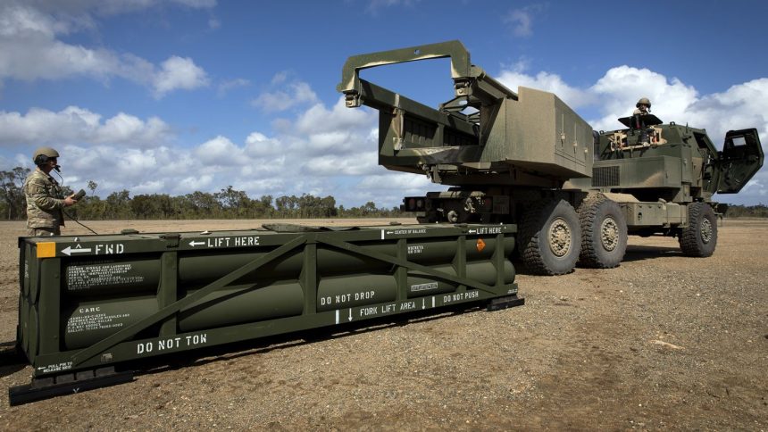 US Army Sgt. Ian Ketterling, gunner for Alpha Battery, 1st Battalion, 3rd Field Artillery Regiment, 17th Field Artillery Brigade, prepares the crane for loading the Army Tactical Missile System (ATACMS) on to the High Mobility Artillery Rocket System (HIMARS) in Queensland, Australia, on July 26, 2023.