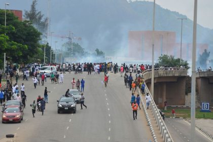 Police fire tear gas during a protest in the Nigerian capital of Abuja in August 2024.