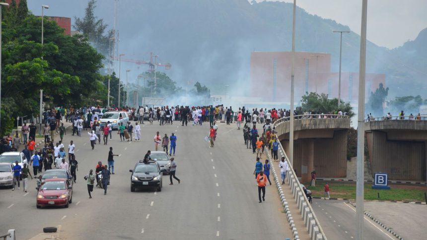 Police fire tear gas during a protest in the Nigerian capital of Abuja in August 2024.