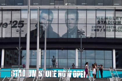 Screens at London's Wembley Stadium advertise Oasis concerts scheduled at the venue in summer 2025.