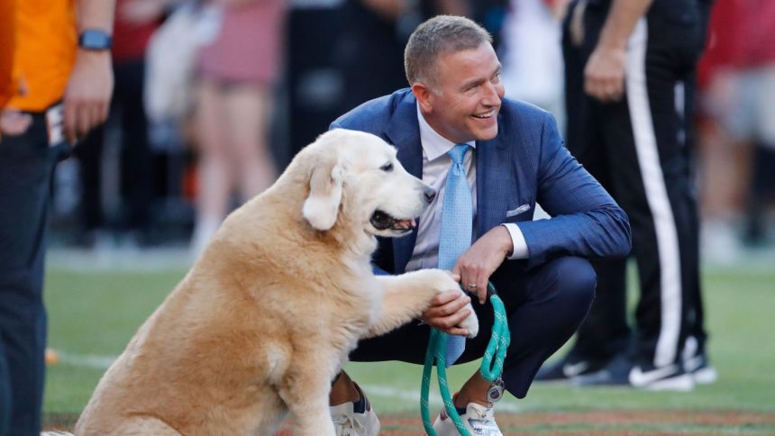 Football analyst Kirk Herbstreit and Ben ahead of October's Tennessee Volunteers and Arkansas Razorbacks football game.