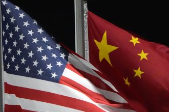 The American and Chinese flags wave at Genting Snow Park, February 2, 2022, in Zhangjiakou, China.