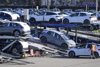 Vehicles are loaded onto car carriers at the Volkswagen plant in Zwickau, Germany, on October 28, 2024.