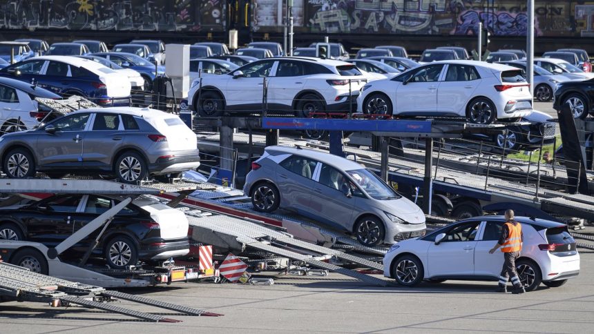 Vehicles are loaded onto car carriers at the Volkswagen plant in Zwickau, Germany, on October 28, 2024.