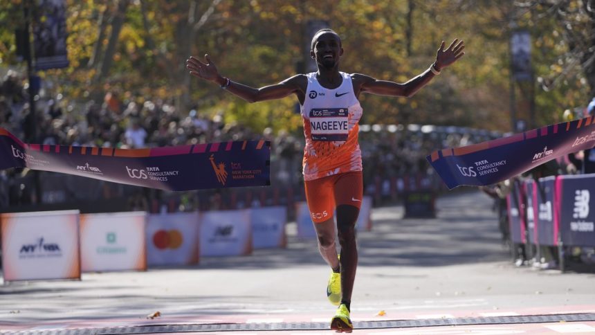 Abdi Nageeye, of the Netherlands, crosses the finish line to win the men's race.