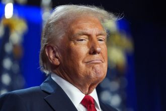 Donald Trump arrives at an election night watch party at the Palm Beach Convention Center, Florida on November 6, 2024.