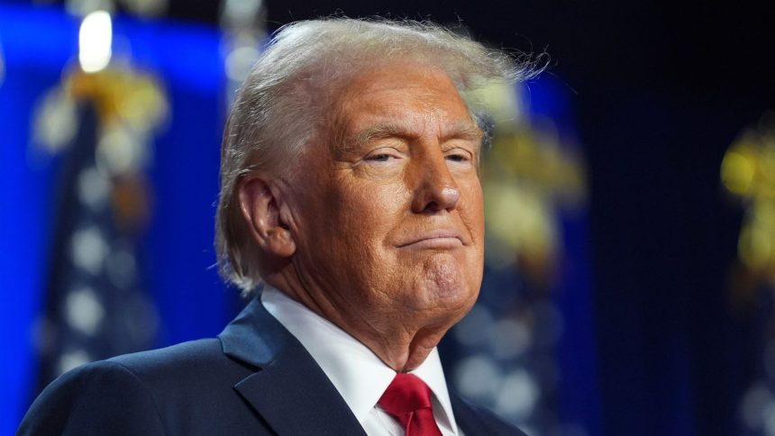 Donald Trump arrives at an election night watch party at the Palm Beach Convention Center, Florida on November 6, 2024.