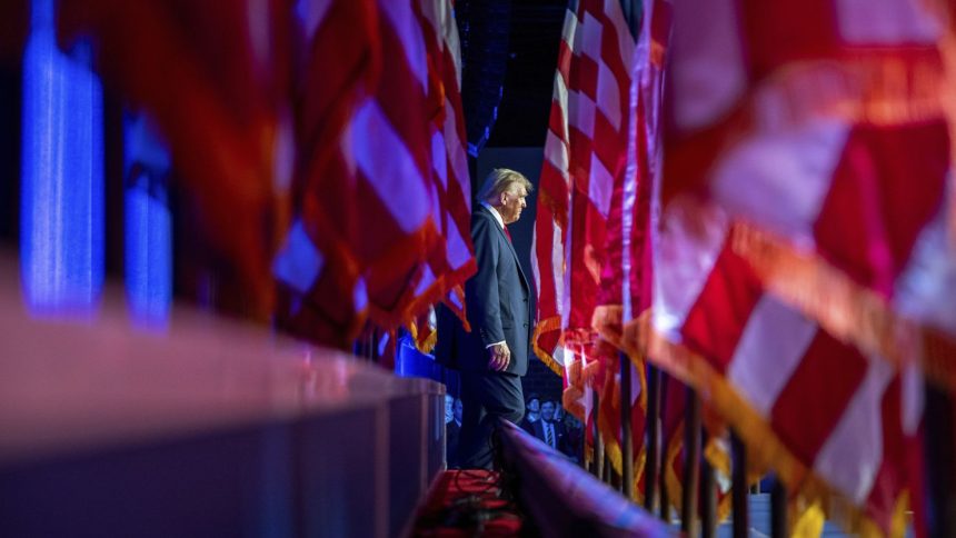 Former President Donald Trump arrives at an election night watch party at the Palm Beach Convention Center on November 6.