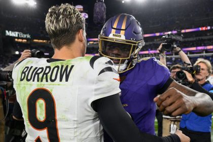 Cincinnati Bengals quarterback Joe Burrow  and Baltimore Ravens quarterback Lamar Jackson (8) embrace after the game.