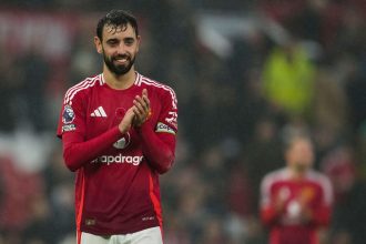 Manchester United's Bruno Fernandes celebrates after helping his team win against Leicester City on Sunday.