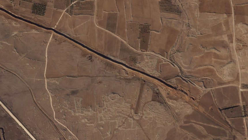 This satellite image from Planet Labs PBC shows Israeli forces digging along the Alpha Line separating the Israeli-occupied Golan Heights from a demilitarized zone in Syria patrolled by United Nations forces on Nov. 5, 2024. (Planet Labs PBC via AP)