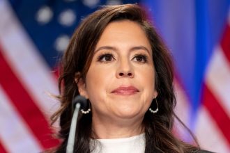 Rep. Elise Stefanik is seated before President-elect Donald Trump arrives at a meeting of the House GOP conference on November 13, 2024, in Washington.