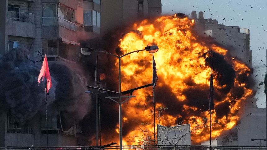 Smoke and flames erupt from a building hit in an Israeli airstrike in Tayouneh, Beirut, Lebanon, November 15, 2024.