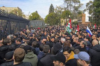 Protesters gather outside the parliament building of the Georgian separatist region of Abkhazia on Friday.