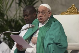 Pope Francis delivers his speech during a mass on the occasion of the World Day of the Poor in St. Peter's Basilica, at the Vatican on Sunday.