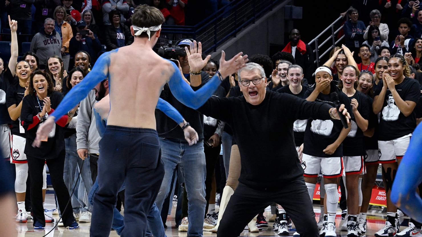 UConn head coach Geno Auriemma celebrates becoming the winningest head coach - men's or women's - in NCAA history.