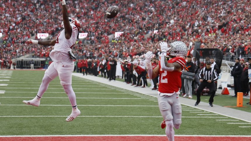 Ohio State receiver Emeka Egbuka catches 11-yard touchdown pass from quarterback Will Howard. (AP Photo/Jay LaPrete)