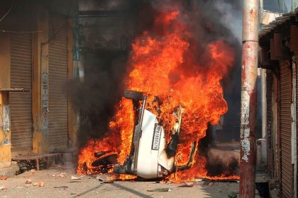 A vehicle burns during a clash between protesters and police in Sambhal, in the northern Indian state of Uttar Pradesh, on November 24, 2024.