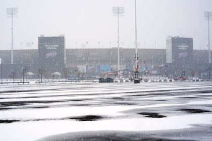 Snow falls on Highmark Stadium and surrounding parking lots in Orchard Park, NY.