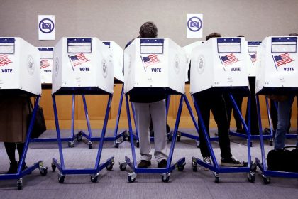 Voters fill out their ballots at a polling station in New York City on Election Day, November 5.