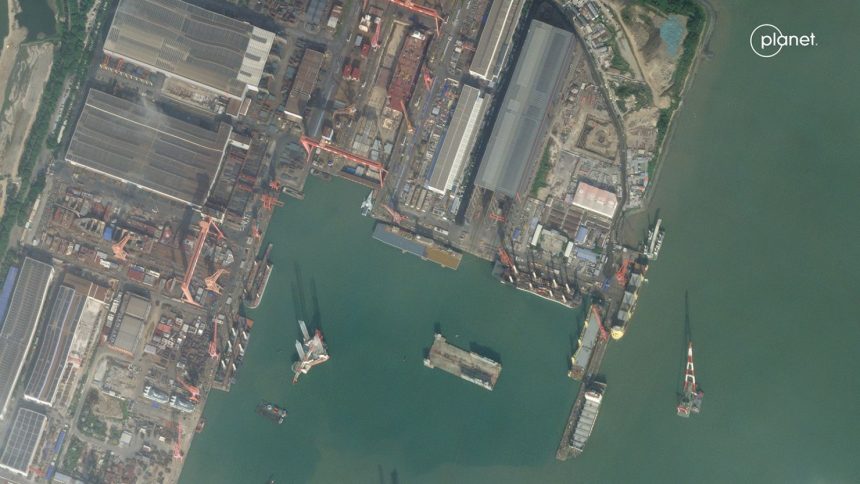 This satellite image captured on October 23, 2024, shows an entirely new class of Chinese vessel with a large open flight deck at a shipyard in the southeastern end of the country.