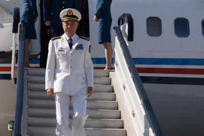 Miao Hua, director of the Political Work Department of China's Central Military Commission, disembarks his aircraft after arriving at Pyongyang International Airport on October 14, 2019.