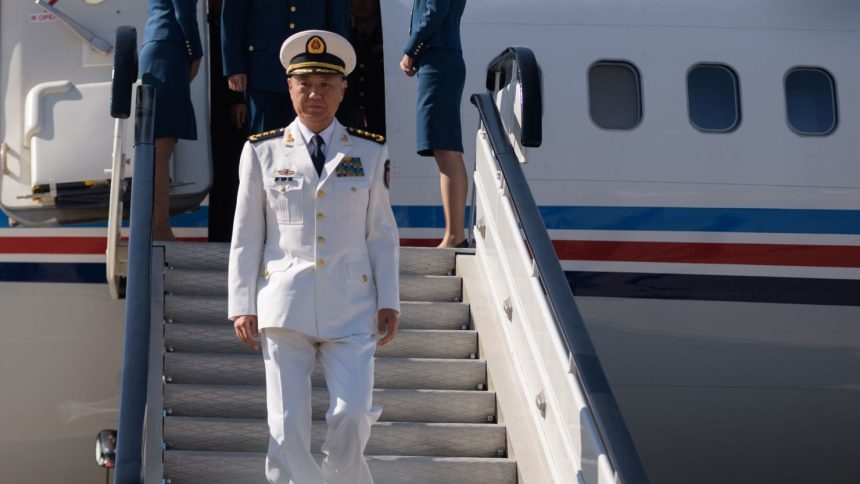 Miao Hua, director of the Political Work Department of China's Central Military Commission, disembarks his aircraft after arriving at Pyongyang International Airport on October 14, 2019.