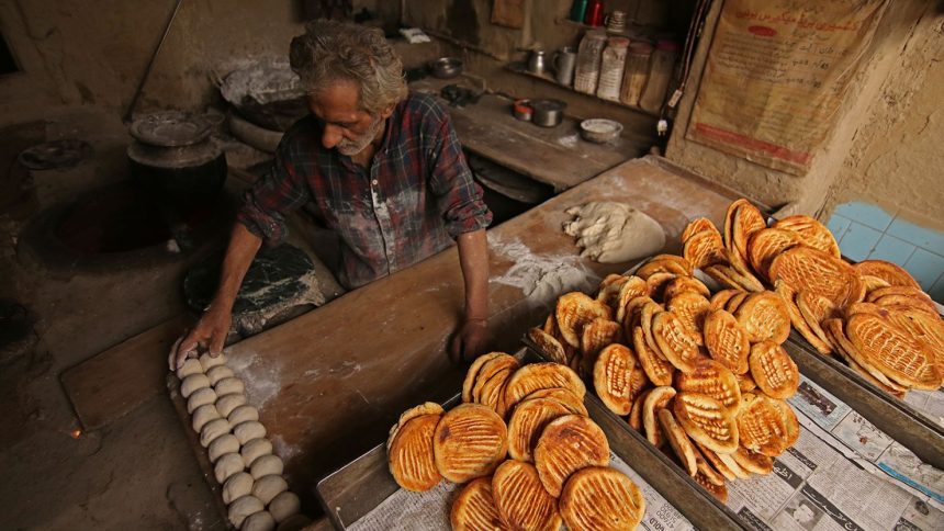 A baker prepares bread in Srinagar, Kashmir, India.